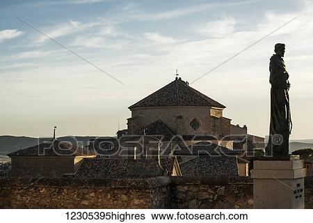 Stock Photograph - Statue and buildings in downtown Cuenca; Cuenca, Castile-La Mancha, Spain. Fotosearch