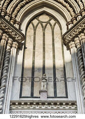 Statue of a man on an ornate wall with twisted columns; Orvieto, Umbria, Italy View Large Photo Image Stock Photograph - Statue of a man on an ornate wall with twisted columns; Orvieto, Umbria, Italy. Fotosearch