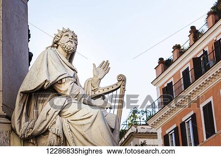 Statue of male figure playing a harp; Rome, Italy View Large Photo Image Stock Photograph - Statue of male figure playing a harp; Rome, Italy. Fotosearch