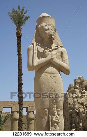 Stock Photo - Statue of Ramses II with his daughter Benta-Anta, Forecourt, Karnak Temple Complex; Luxor, Egypt. Fotosearch