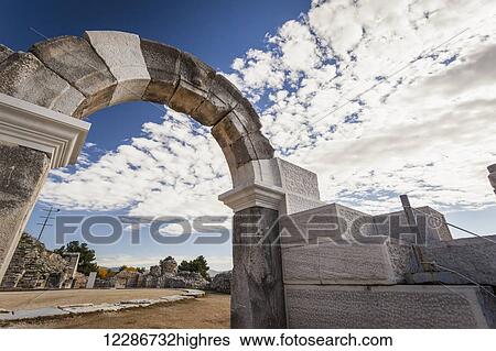 Stock Photograph - Stone arch at the entrance to the amphitheatre; Philippi, Greece. Fotosearch