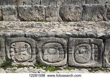Stock Photo - Stone carved hieroglyphs, Structure of Five Floors (Pisos), Edzna Mayan archaeological site; Campeche, Mexico. Fotosearch