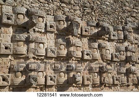 Stock Image - Stone images of the Rain God Chac, Palace of Masks, Kabah archaeological site; Yucatan, Mexico. Fotosearch