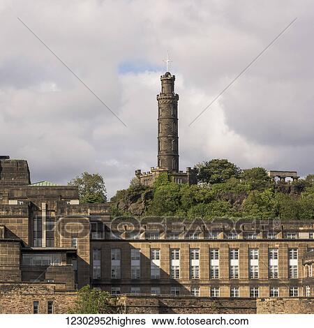 Stock Photograph - Stone tower of Edinburgh Castle against a cloudy sky; Edinburgh, Scotland. Fotosearch