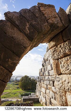 Stock Photograph - Stone wall and arch at the amphitheatre; Philippi, Greece. Fotosearch