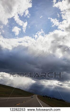 Stock Image - Storm clouds gather in Souther Alberta; Alberta, Canada. Fotosearch