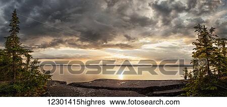 Stock Photograph - Storm clouds over Lake Superior; Thunder Bay, Ontario, Canada. Fotosearch