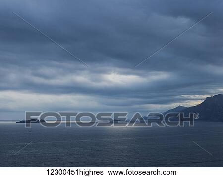 Stock Photograph - Storm clouds over the Amalfi coast; Amalfi, Italy. Fotosearch