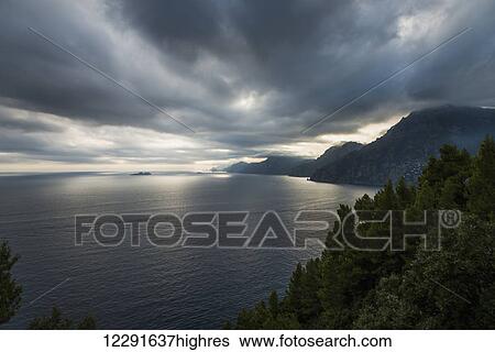 Stock Photograph - Storm clouds over the mediterranean along the Amalfi coast; Praiano, Campania, Italy. Fotosearch