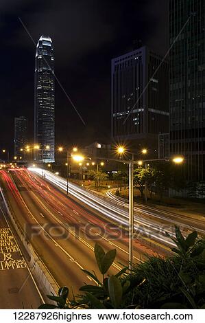 Streaks of light from traffic outside skyscraper; Hong Kong, China View Large Photo Image Stock Photograph - Streaks of light from traffic outside skyscraper; Hong Kong, China. Fotosearch