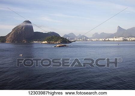 Stock Photograph - Sugarloaf Mountain, Botafogo, Christ the Redeemer statue; Rio de Janeiro, Brazil. Fotosearch