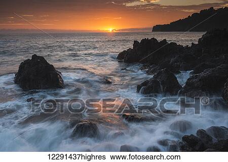Sunrise and surf over rocks; Hawaii, United States of America View Large Photo Image Stock Photograph - Sunrise and surf over rocks; Hawaii, United States of America. Fotosearch