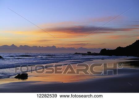 Stock Photo - Sunrise at Port Macquarie beach; Port Macquarie, New South Wales, Australia. Fotosearch
