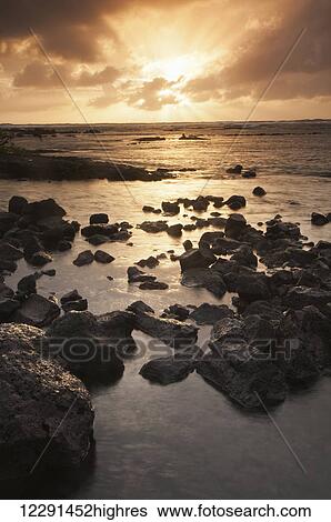 Sunrise on the eastern shore of the Big Island, near Hilo; Island of Hawaii, Hawaii, United States of America View Large Photo Image Stock Photograph - Sunrise on the eastern shore of the Big Island, near Hilo; Island of Hawaii, Hawaii, United States of America. Fotosearch