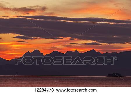 Sunset along the Inside Passage near Juneau, Favorite Passage, Chilkat Mountains; Alaska, United States of America View Large Photo Image Stock Image - Sunset along the Inside Passage near Juneau, Favorite Passage, Chilkat Mountains; Alaska, United States of America. Fotosearch