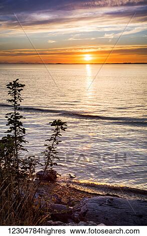 Stock Photograph - Sunset at Crescent Beach; Surrey, British Columbia, Canada. Fotosearch