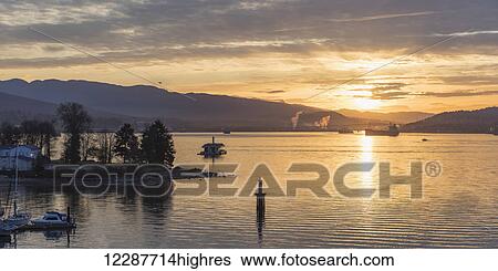 Sunset light reflecting on the ocean off the coast at Stanley Park; Vancouver, British Columbia, Canada View Large Photo Image Stock Photograph - Sunset light reflecting on the ocean off the coast at Stanley Park; Vancouver, British Columbia, Canada. Fotosearch