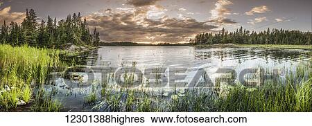 Sunset over a pond; Thunder Bay, Ontario, Canada View Large Photo Image Stock Photograph - Sunset over a pond; Thunder Bay, Ontario, Canada. Fotosearch