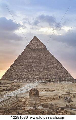 Stock Photograph - Sunset, Sphinx (foreground), The Pyramid of Chephren (background), The Pyramids of Giza; Giza, Egypt. Fotosearch