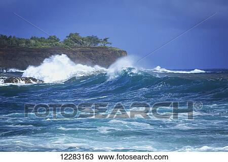 Stock Image - Surf batters North Kohala shore in Keokea Beach Park; Kapaa, Island of Hawaii, Hawaii, United States of America. Fotosearch