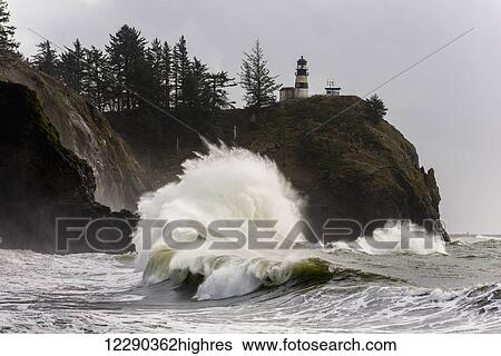 Surf breaks at Cape Disappointment Lighthouse; Ilwaco, Washington, United States of America View Large Photo Image Stock Photograph - Surf breaks at Cape Disappointment Lighthouse; Ilwaco, Washington, United States of America. Fotosearch