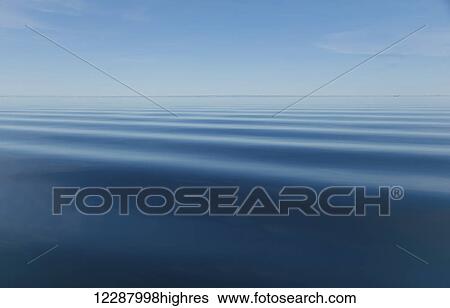 Stock Photograph - Surface of blue water with slight ripples and blue sky with horizon in the distance. Fotosearch