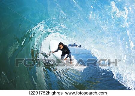 Stock Photograph - Surfer On Blue Ocean Wave. Fotosearch