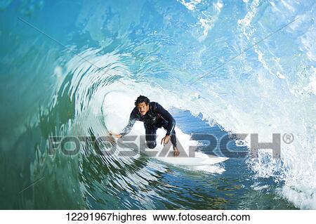 Surfer On Blue Ocean Wave View Large Photo Image Stock Photograph - Surfer On Blue Ocean Wave. Fotosearch