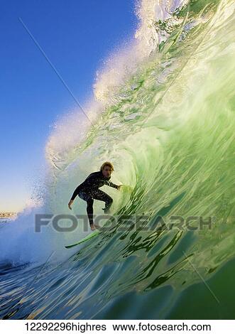 Stock Photograph - Surfer On Blue Ocean Wave. Fotosearch