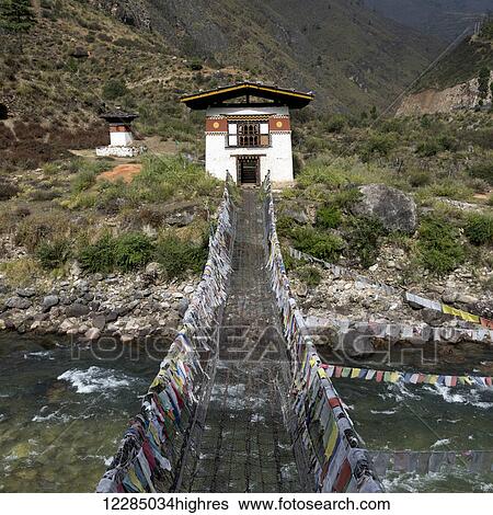 Suspension bridge made from wood and chain across Paro river, near Tachog Lhakhang Dzong; Paro, Bhutan View Large Photo Image Stock Photograph - Suspension bridge made from wood and chain across Paro river, near Tachog Lhakhang Dzong; Paro, Bhutan. Fotosearch