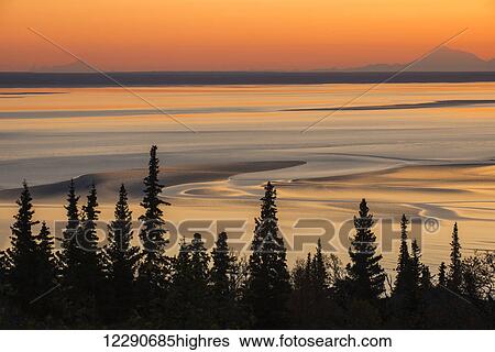 Swirling patterns in the mudflats at low tide and sunset, with Mt. Iliamna and Mt. Redoubt on the horizon, Turnagain Arm, Southcentral Alaska View Large Photo Image Stock Photograph - Swirling patterns in the mudflats at low tide and sunset, with Mt. Iliamna and Mt. Redoubt on the horizon, Turnagain Arm, Southcentral Alaska. Fotosearch