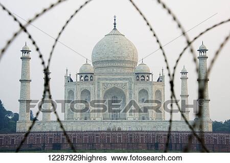 Taj Mahal through barbed wire; Agra, Uttar Pradesh, India View Large Photo Image Stock Photograph - Taj Mahal through barbed wire; Agra, Uttar Pradesh, India. Fotosearch