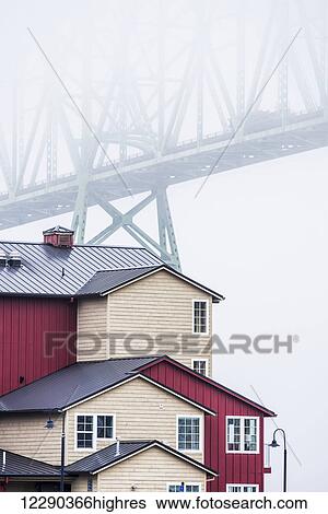 Stock Photograph - The Astoria-Megler Bridge disappears into the fog; Astoria, Oregon, United States of America. Fotosearch
