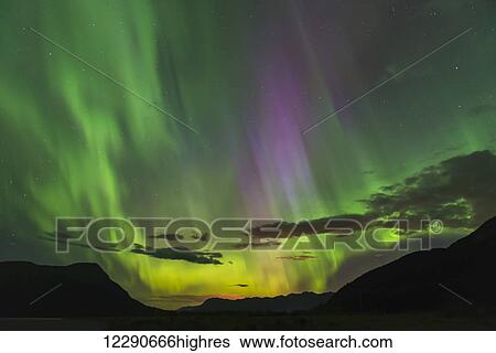 The aurora borealis fills the sky over the Chugach and Kenai Mountains, Southcentral Alaska View Large Photo Image Stock Photograph - The aurora borealis fills the sky over the Chugach and Kenai Mountains, Southcentral Alaska. Fotosearch