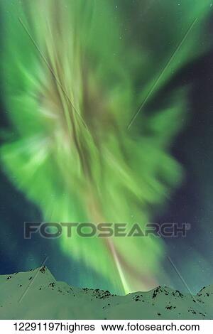 The aurora borealis towers over the Talkeetna Mountains in Hatcher Pass State Recreation Area, Alaska. View Large Photo Image Stock Photograph - The aurora borealis towers over the Talkeetna Mountains in Hatcher Pass State Recreation Area, Alaska.. Fotosearch