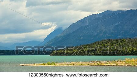 The glacial blue waters of Naknek Lake; Alaska, United States of America View Large Photo Image Stock Photograph - The glacial blue waters of Naknek Lake; Alaska, United States of America. Fotosearch