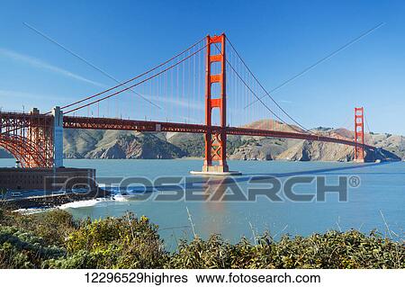 Stock Photograph - The Golden Gate Bridge in San Francisco with beautiful blue ocean in background. Fotosearch