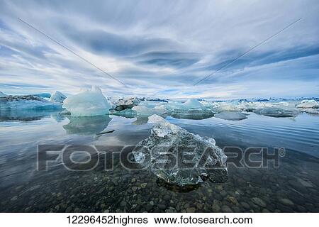 The icebergs of the ice lagoon known as Jokulsarlon along the south coast of Iceland; Iceland View Large Photo Image Stock Photograph - The icebergs of the ice lagoon known as Jokulsarlon along the south coast of Iceland; Iceland. Fotosearch