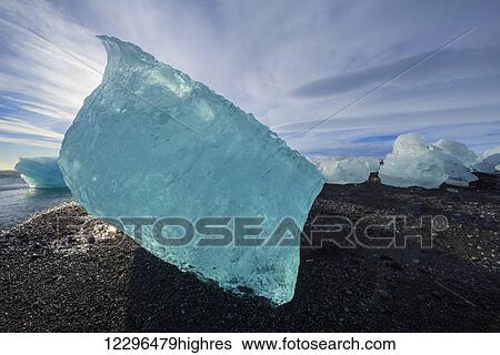 Stock Photograph - The icebergs of the ice lagoon known as Jokulsarlon along the south coast of Iceland; Iceland. Fotosearch