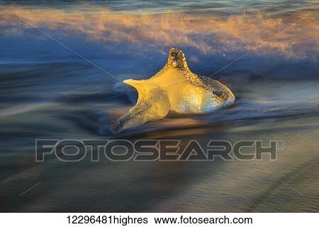 Stock Photograph - The icebergs of the ice lagoon known as Jokulsarlon along the south coast of Iceland; Iceland. Fotosearch