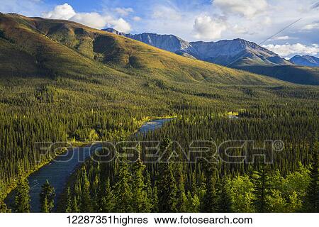 Stock Photograph - The Lapie River runs through the wilderness along the South Canol Road; Yukon, Canada. Fotosearch