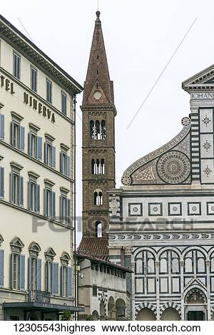 Stock Photograph - The ornate facade of buildings and a tower; Florence, Italy. Fotosearch
