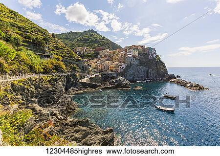 Stock Photograph - The picturesque cliffside viewpoint of the village of Manarola in Cinque Terre National Park on the Mediterranean Sea; Manarola, Italy. Fotosearch