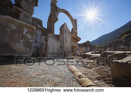 Stock Photograph - The Pollio Fountain, located to the south of the State Agora, across the Odeion, built in 97 A. D by the rich Ephesian C. S. Pollio and his family; Ephesus, Turkey. Fotosearch