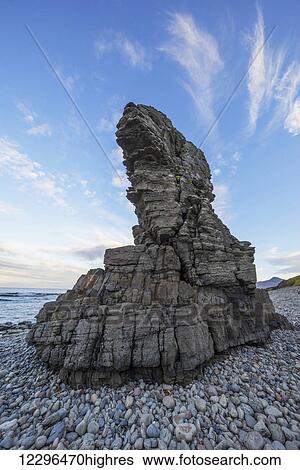 Stock Photograph - The sea stacks known as Thrjatiudalastapi; West Fjords, Iceland. Fotosearch
