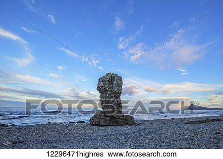 Stock Photograph - The sea stacks known as Thrjatiudalastapi; West Fjords, Iceland. Fotosearch