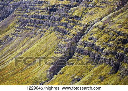 The steep sided cliffs of Icelands Westfjords are very colourful in any season; Iceland View Large Photo Image Stock Photograph - The steep sided cliffs of Icelands Westfjords are very colourful in any season; Iceland. Fotosearch