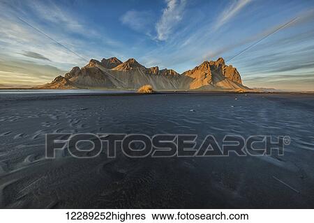 Stock Photograph - The tidal flats at low tide at Vestrahorn, also known as Stokknes in Eastern Iceland; Iceland. Fotosearch
