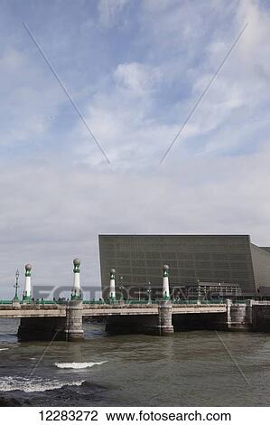 The two glass cubes of the Kursaal, cultural centre, which rise next to the Rio Urumea and the Zurriola beach in the Gros district of the city; San Sebastian, Spain View Large Photo Image Stock Image - The two glass cubes of the Kursaal, cultural centre, which rise next to the Rio Urumea and the Zurriola beach in the Gros district of the city; San Sebastian, Spain. Fotosearch