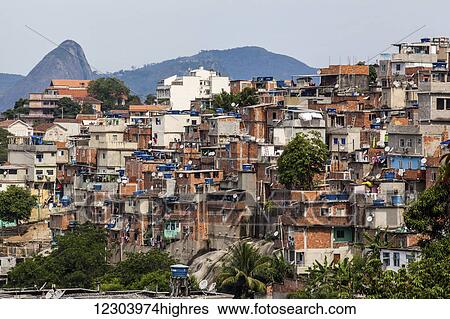 Stock Photograph - The view from Santa Teresa looking towards Sugarloaf Mountain with a favela in the foreground; Rio de Janeiro, Brazil. Fotosearch